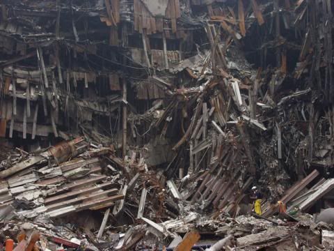These-rescue-workers-are-dwarfed-by-the-enormous-pile-of-rubble-at-the-site-of-the-World-Trade-Center.jpg