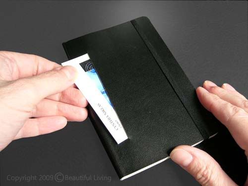 Business card slit in Moleskine soft notebook a 4 slit is just the right size to slip a small stash of business cards.