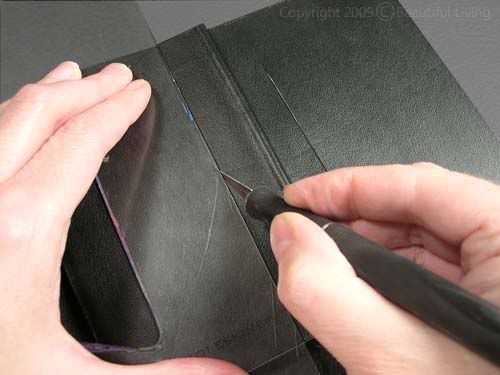 Cutting the soft cover Moleskine cover I cut slits in the Moleskines front and back covers that were 4 tall and 3/4 away from the spine. The slit was centered vertically so they would be at the same height on both sides.