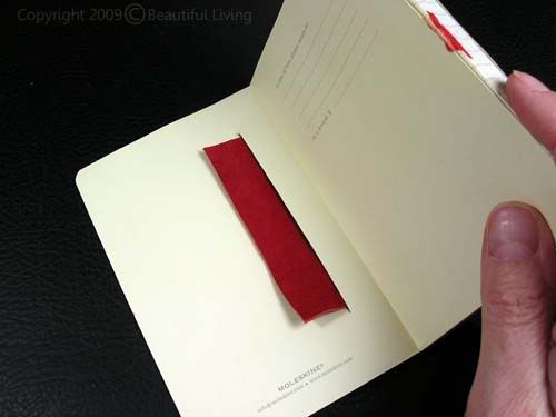 Glueing the leather into the Moleskines back cover.